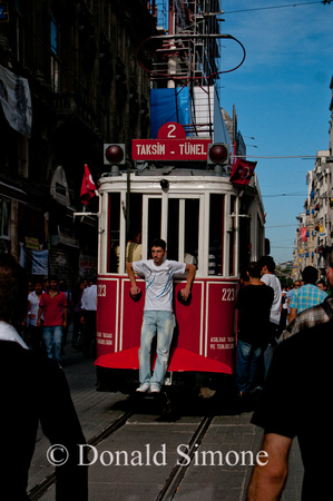 Riding the trolley on Istiklal Caddesi in Beyoglu, Istanbul
