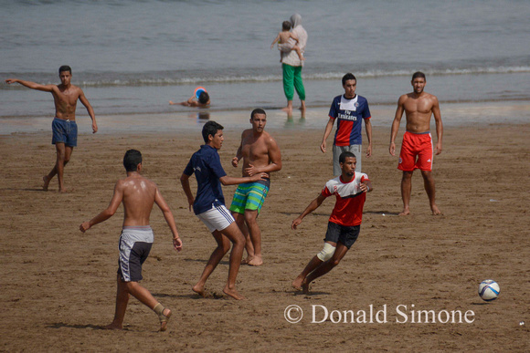 Football on beach at Rabat