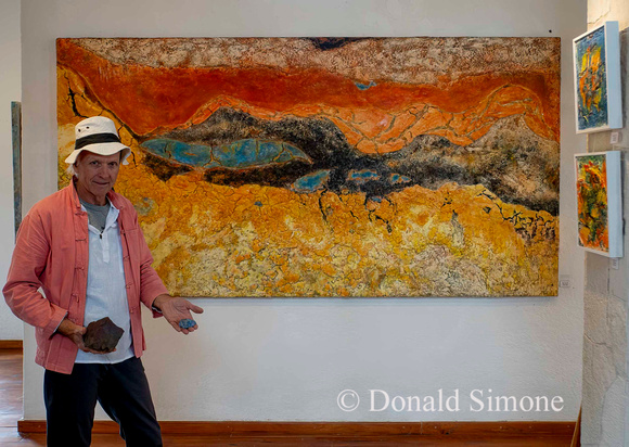 Heinz Kunzli with one of his paintings.