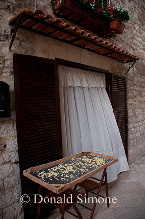 Fresh homemade orechiette drying in Bari Vecchia